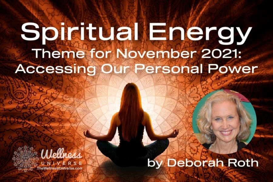 Woman sitting in lotus position with energy rays emanating from her