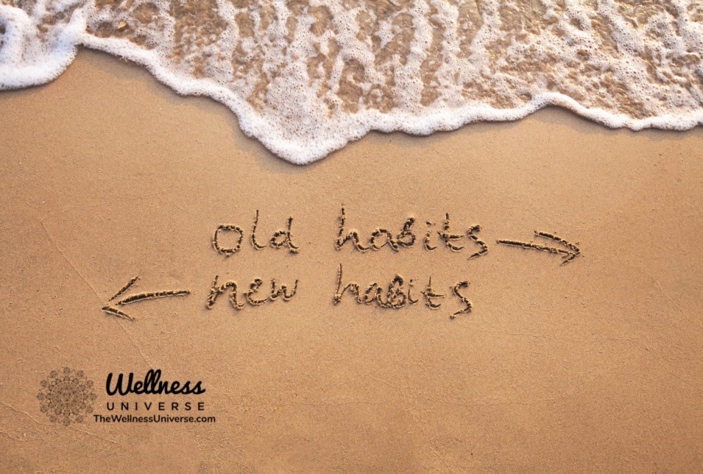old habits and new habits written on a sandy shore