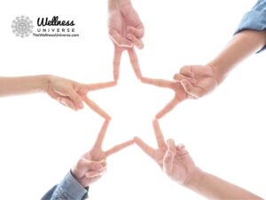 a group of hands making a star shape