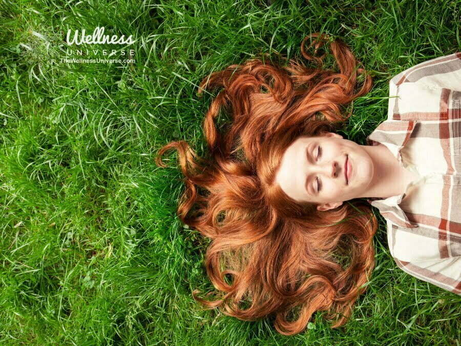 woman laying in the grass